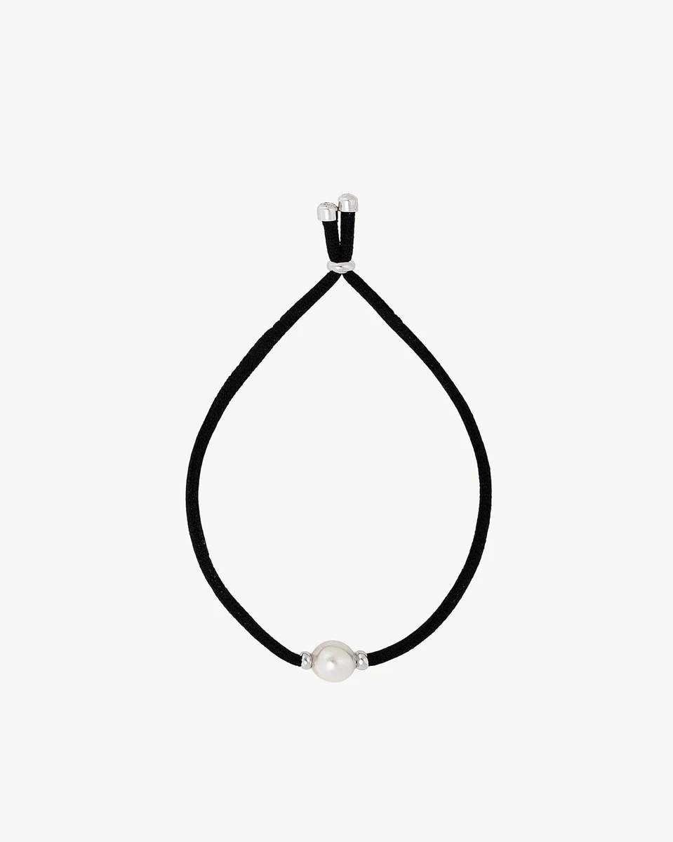 Black bracelet with white pearl, front view in a circular arrangement on a white background.