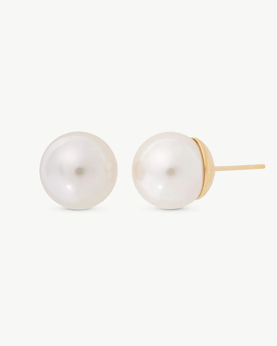 Front view of pearl stud earrings on a white background, showing the gold post profile.