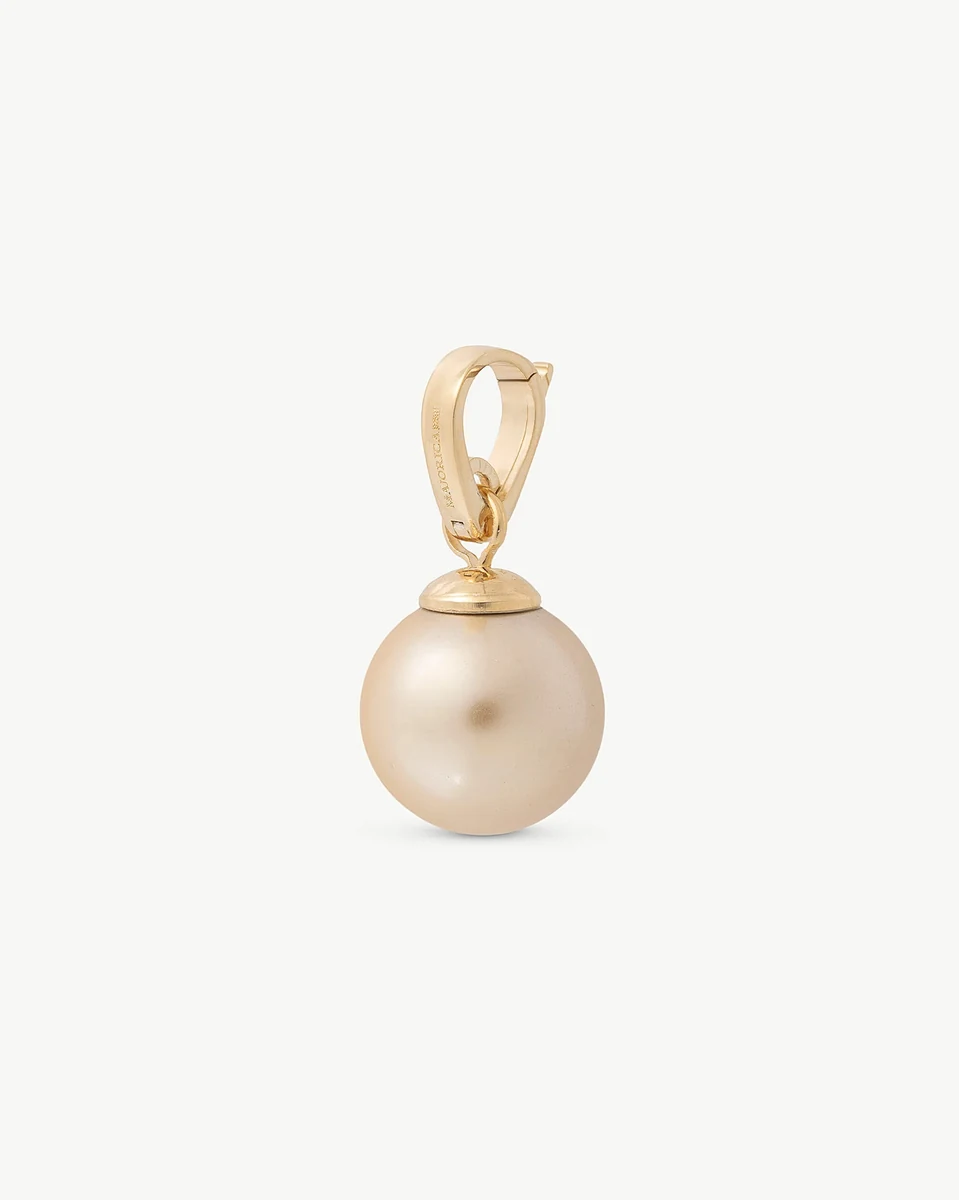 Champagne pearl charm front view, straight angle, on a neutral white background.