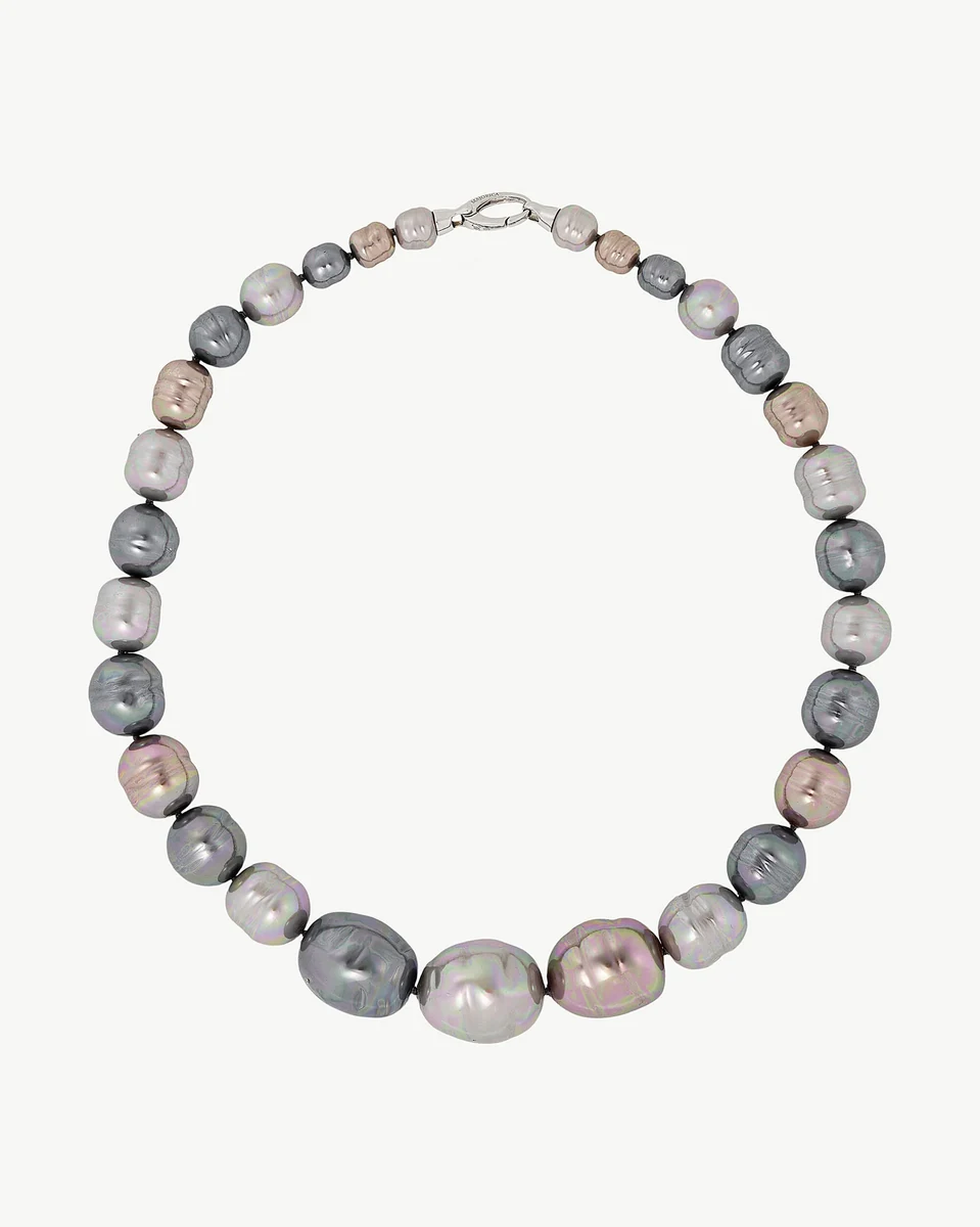 Baroque pearl necklace arranged in a circular shape on a white background, full frontal view.