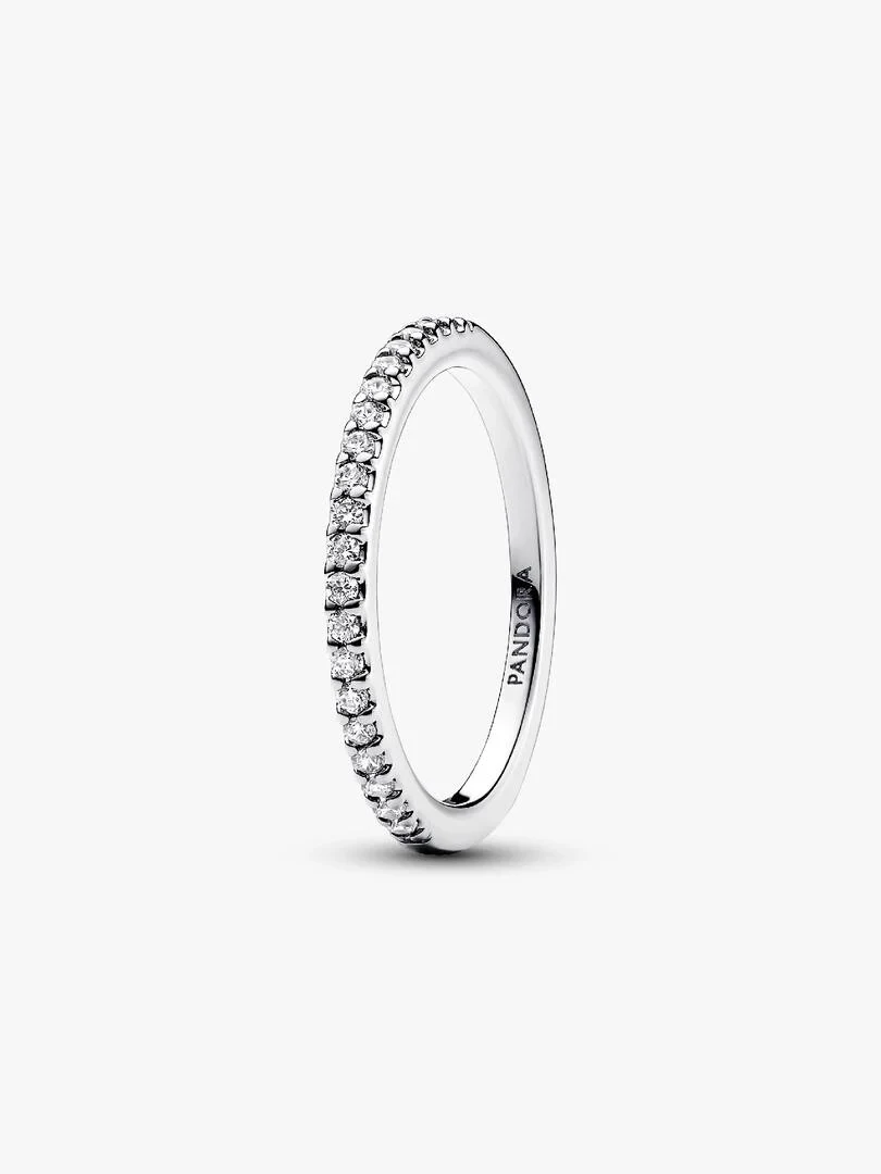 Side angle view of a pavé band ring on a white background, showing the brand engraving.