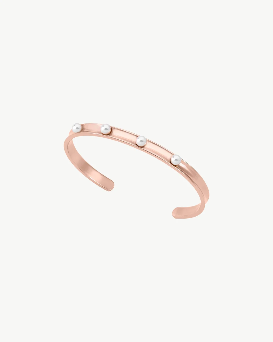 Rose steel bangle with white pearls, side angle view on a white background.