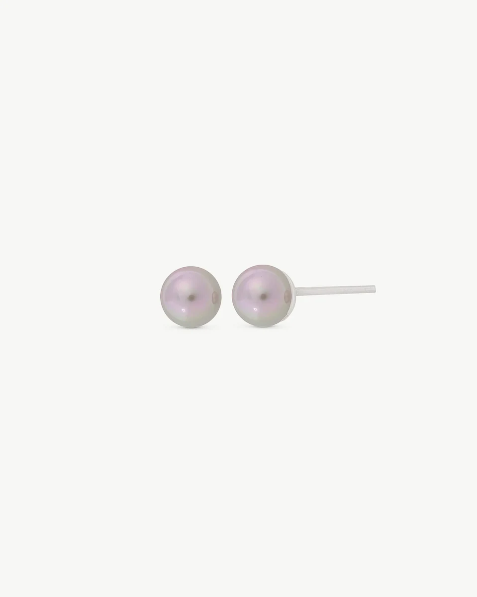Front view of pearl stud earrings on a white background, showing the side profile of the post.