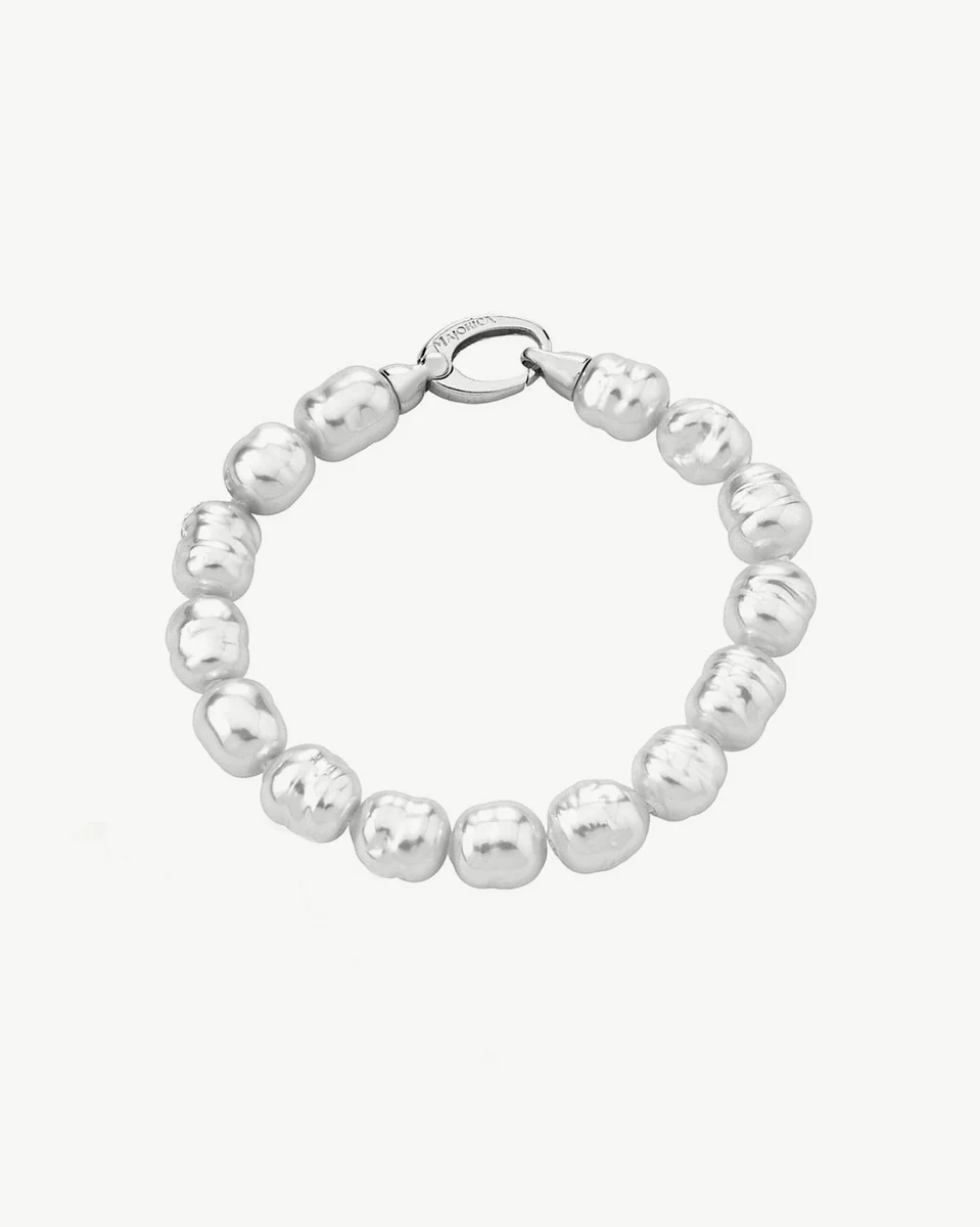 Baroque pearl bracelet arranged in a circle, top view, on a pure white background.