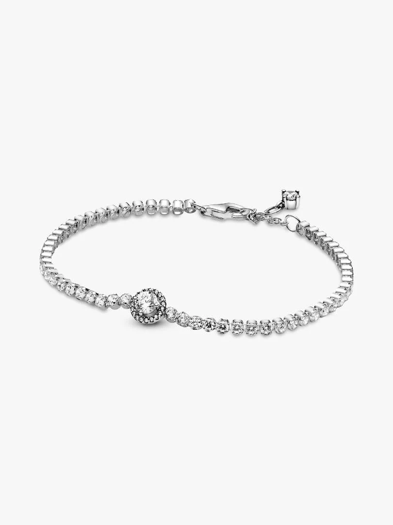 Tennis bracelet arranged in a circle on a white background, front view showing the clasp detail.