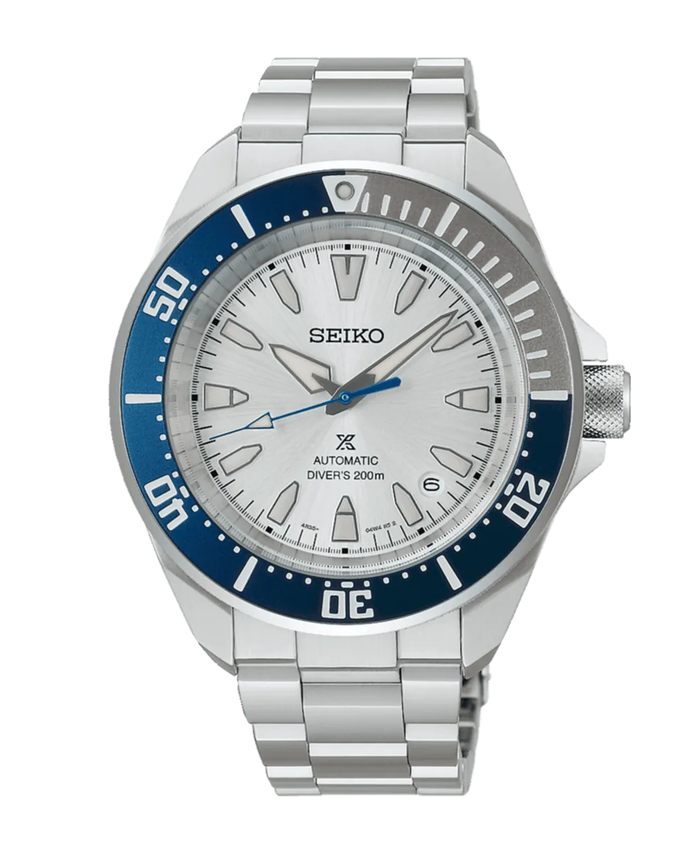Vista frontal completa del reloj con bisel azul y esfera blanca, fondo blanco neutro.