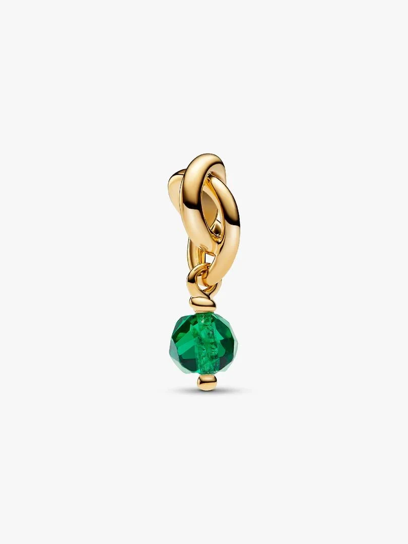 Gold charm pendant with faceted green crystal, front view on white background.