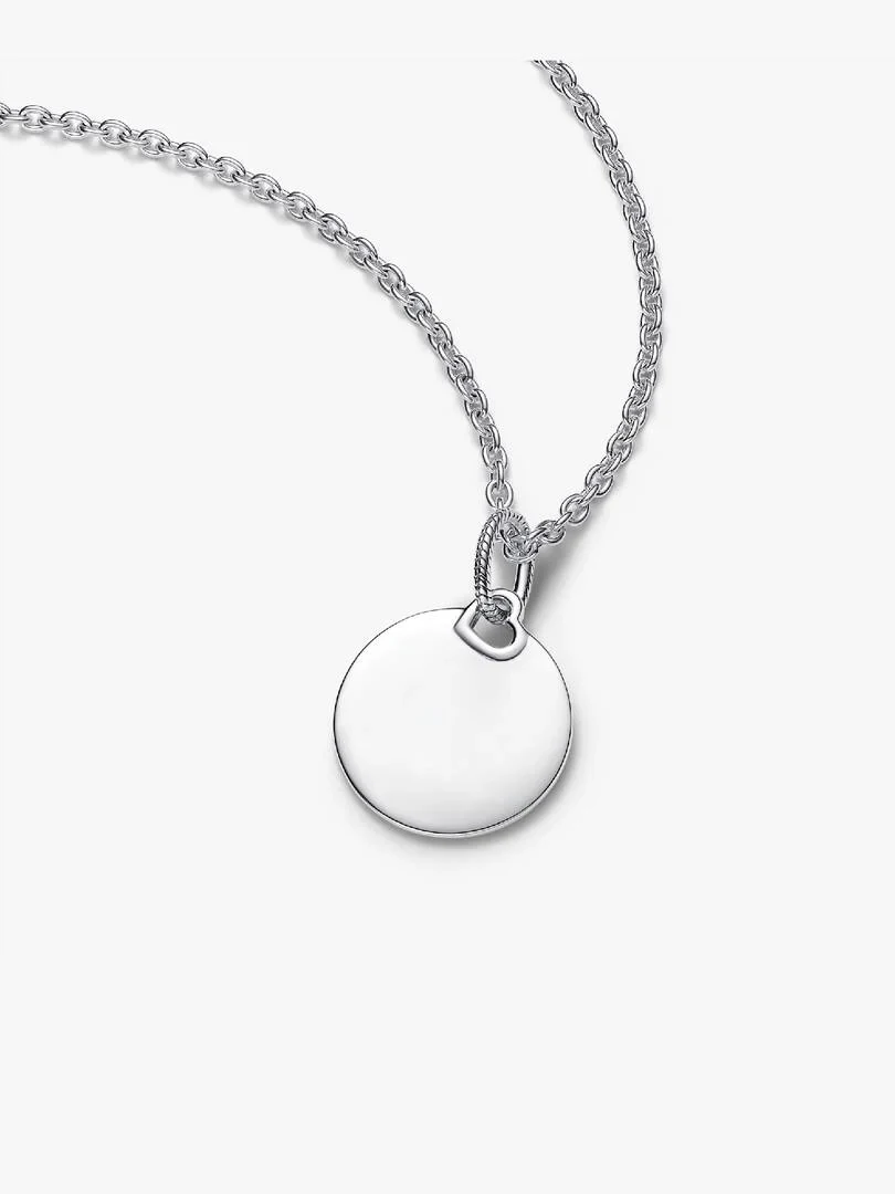 Necklace with round tag pendant on white background, front view with chain positioned diagonally.