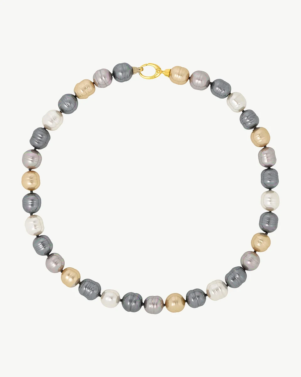 Baroque pearl necklace arranged in a circle on a white background, full frontal view.