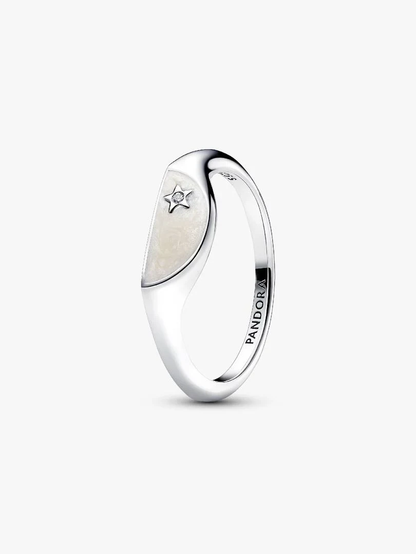 Silver ring shown from a side angle, white background, detail of the star and cubic zirconia inlay.