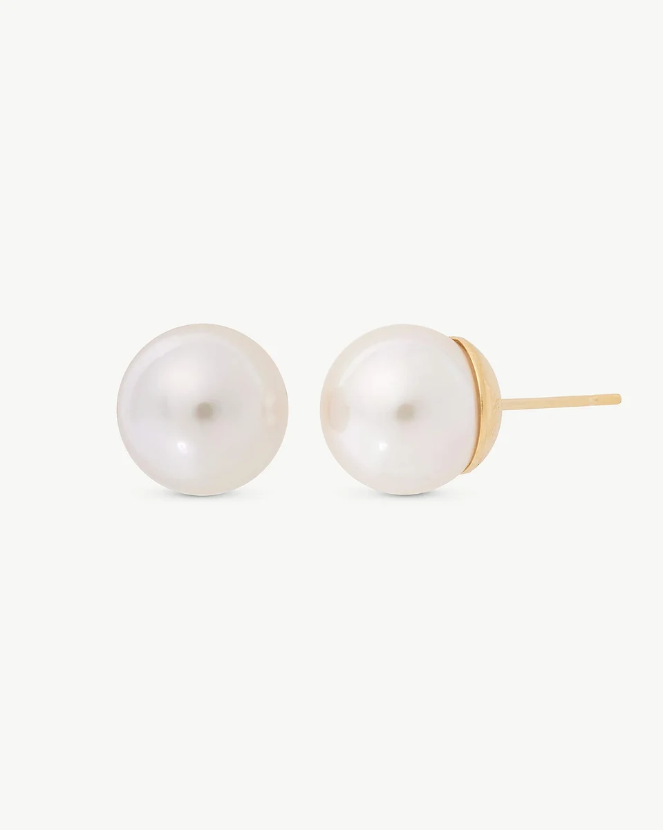 Front view of pearl stud earrings on a white background, showing the gold post from the side.