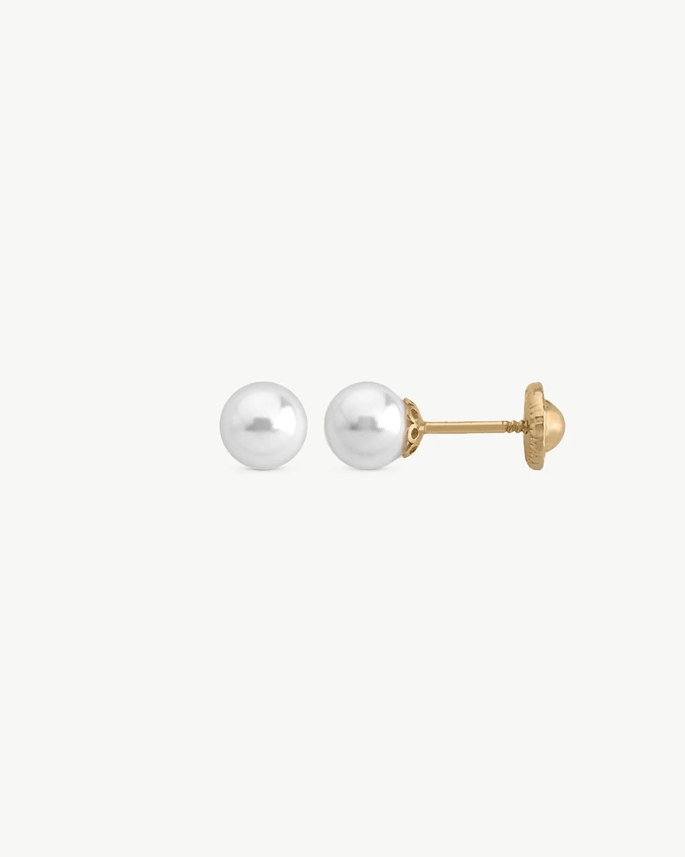 Pearl stud earrings with gold post shown in profile view, white background, focus on the safety back.