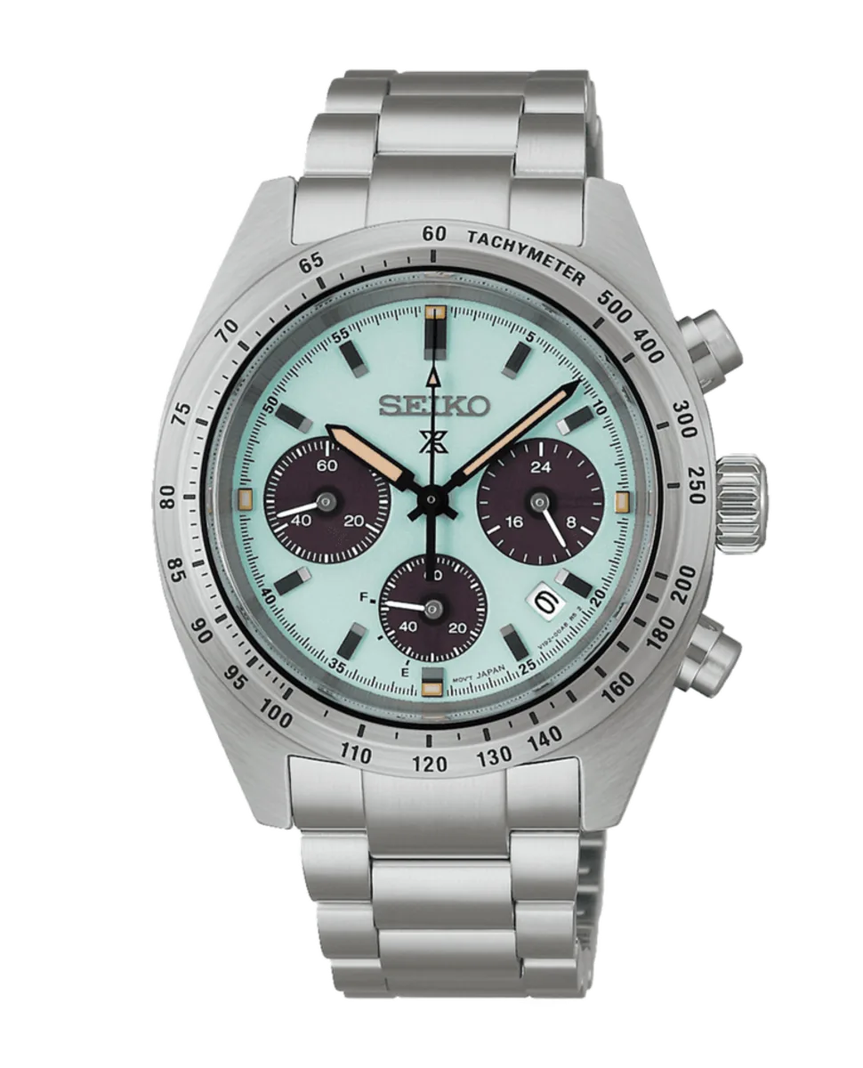 Vista frontal completa del reloj sobre fondo blanco, destacando la esfera verde menta y el brazalete de acero.