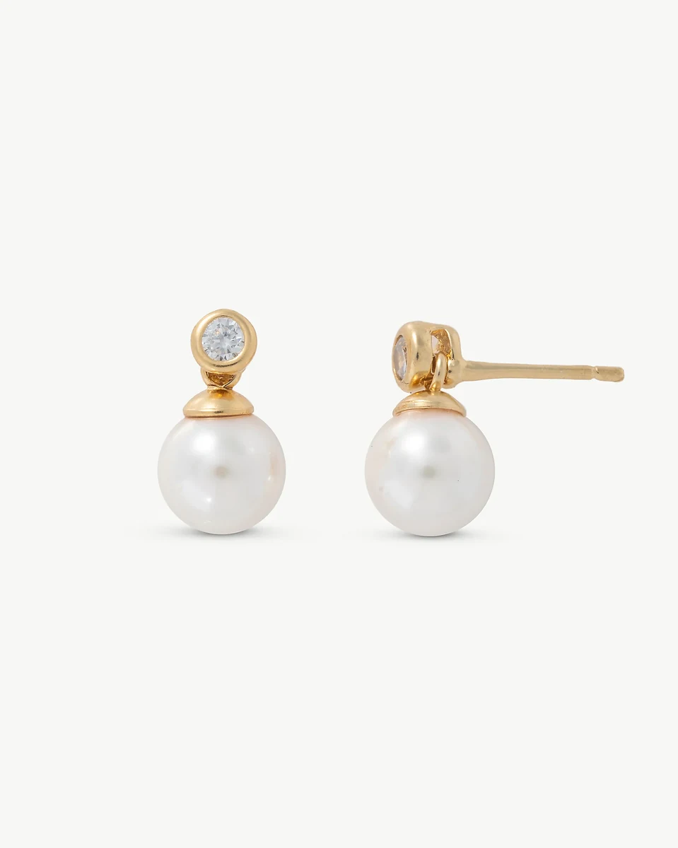 Front and side view of the earrings on a white background, showing pearl and cubic zirconia details.