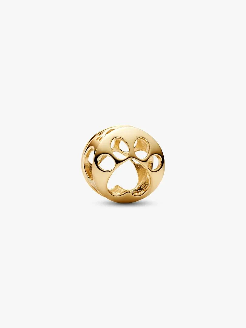 Gold paw print charm shown from a side angle on a solid white background.