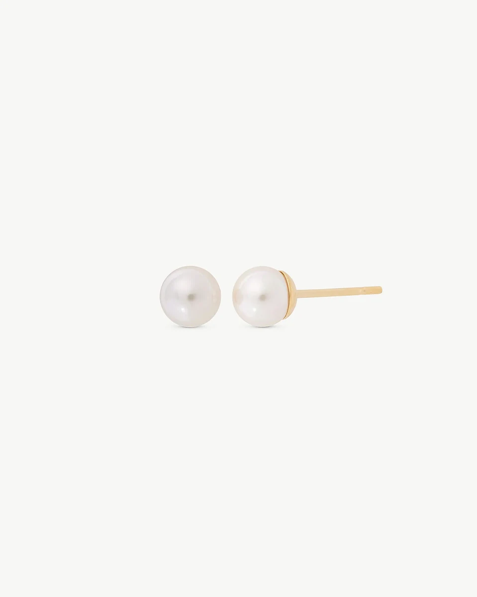 Pair of pearl stud earrings shown front and profile view on a pure white background.