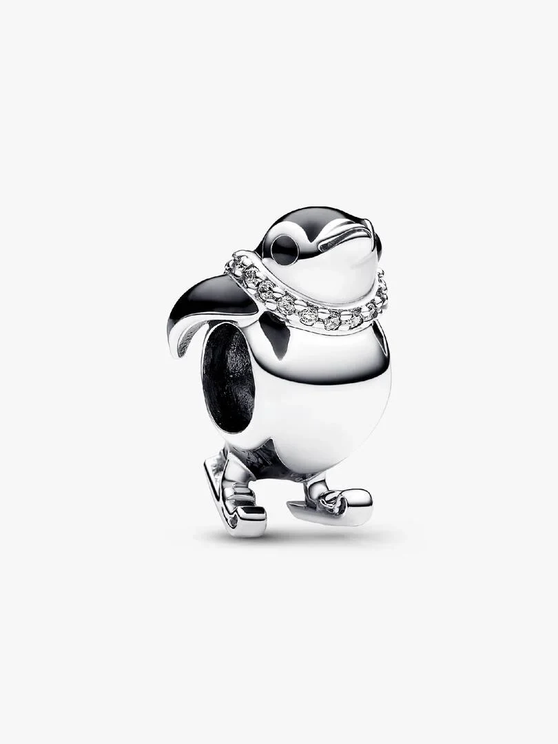 Charm pingouin en argent avec émail noir et détails en zircons, vue de profil sur fond blanc.