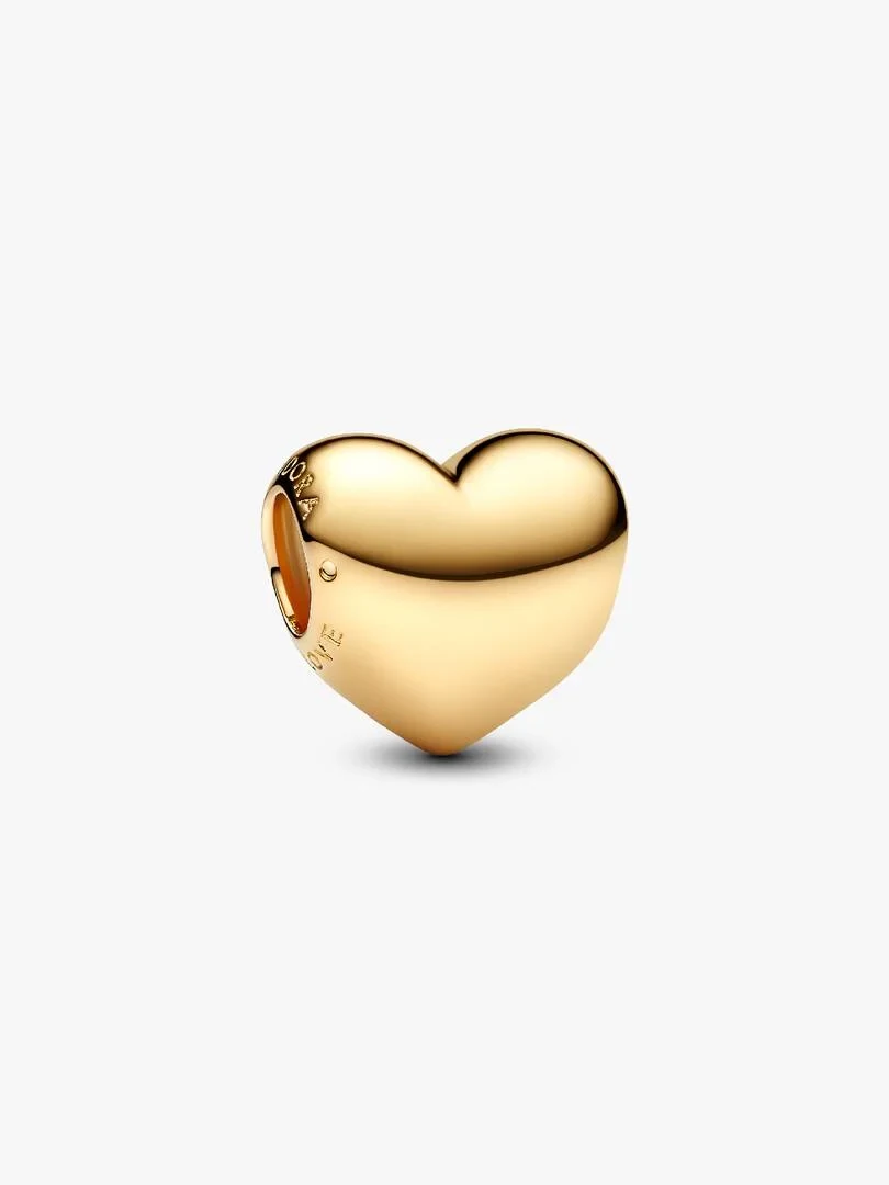 Gold heart charm in a three-quarter view, angled shot on a solid white background.