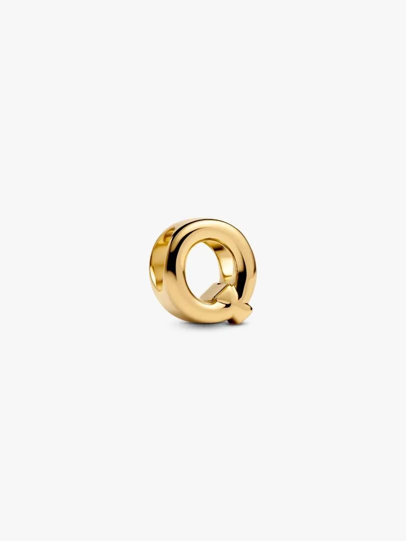 Gold-tone letter Q charm, side angle view, isolated on a white background.