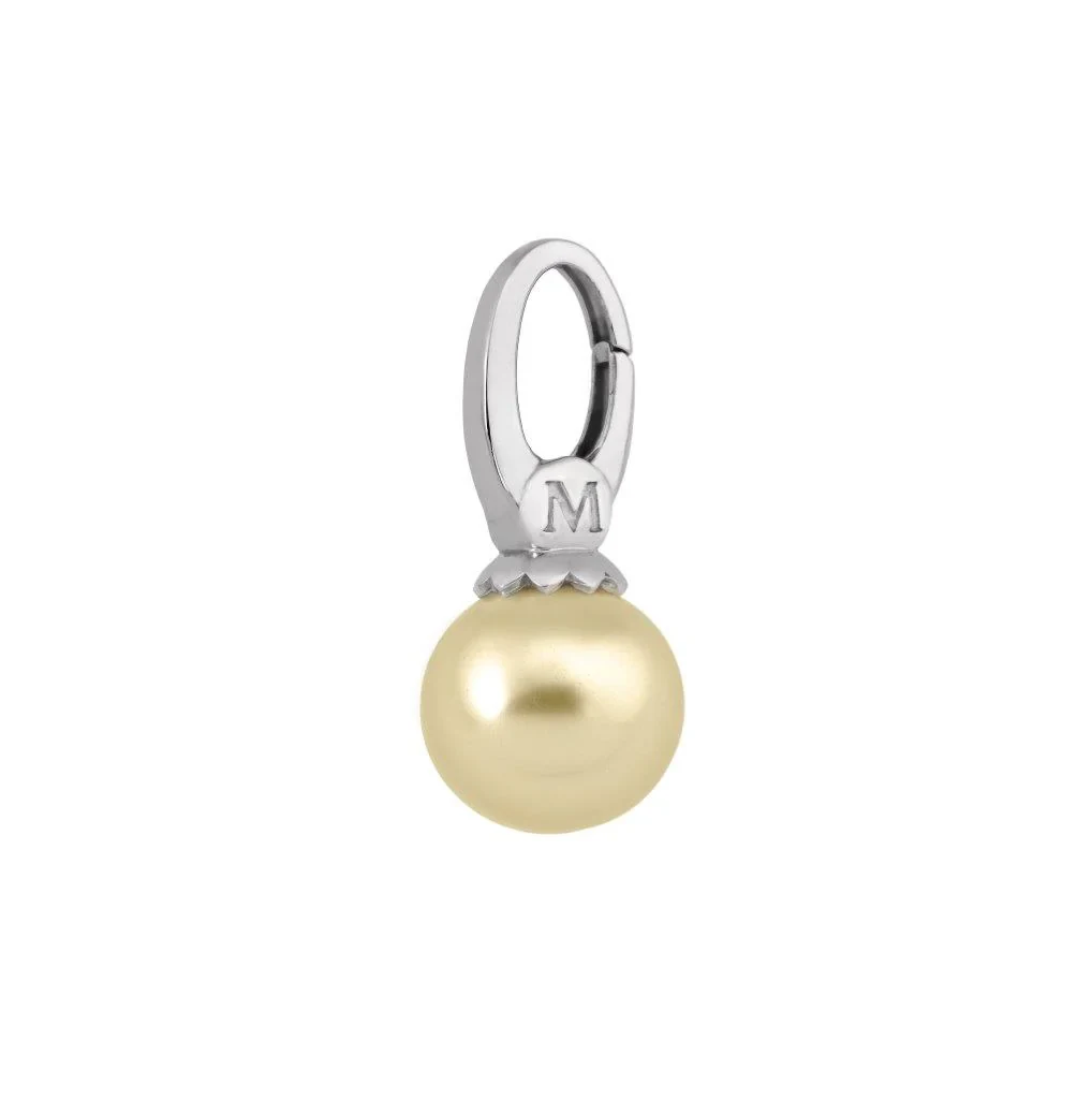 Front view of champagne pearl charm with engraved 'M' steel setting, isolated on white background.