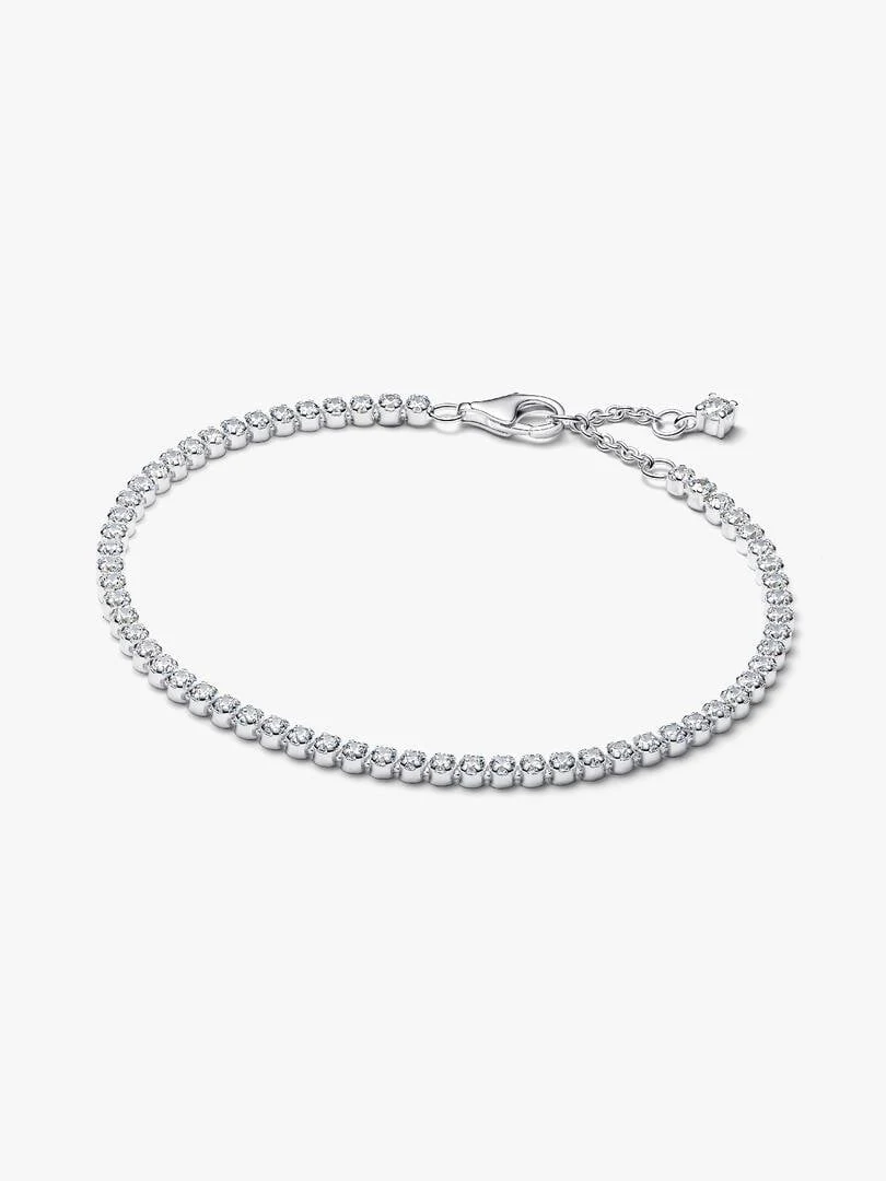 Tennis bracelet viewed from a top angle, arranged in a circular shape on a white background.