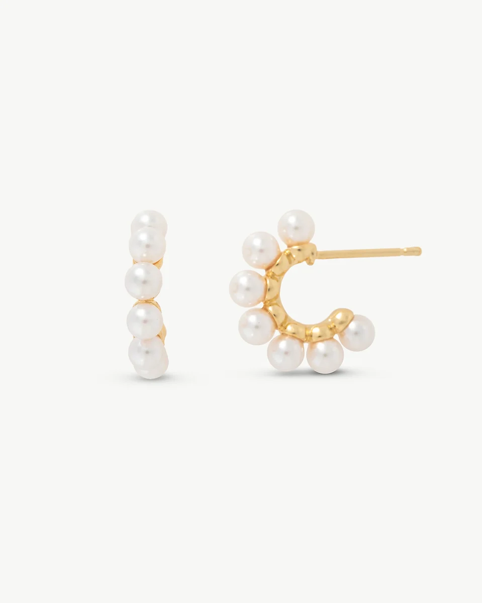 Front and side view of the pearl hoop earrings on a white background.