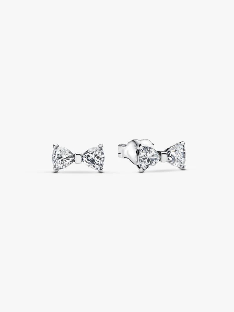 Pair of silver bow stud earrings with cubic zirconia, front and side view on white background.